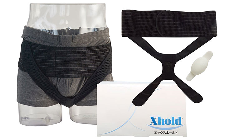 <div class='lum-box'><h4 class='fontColor_blue lum-font-size'>エックスホールド</h4></div><div class='lum-font-cnt'>前立腺全摘出後（前立腺がん手術後）などに起こる排尿障害（尿もれ）の新しい医療機器X(エックス)ホールド®は前立腺を摘出した際に、独自開発のクッションを会陰部に当て、尿道括約筋の収縮不全を補う医療機器です。
膀胱頸部の下垂を防ぐことにより、排尿コントロールが可能となります。</div>